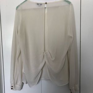 Sheer white top with open back